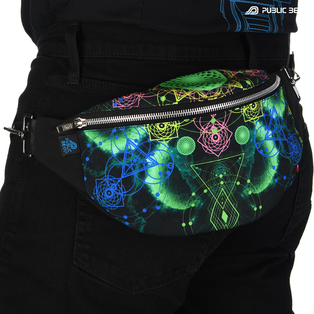 UV-reactive bum bag with green and blue sacred geometry vajra mandala print, photographed in natural light