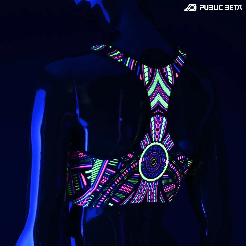 Active top with geometric UV-reactive graphics glowing under blacklight