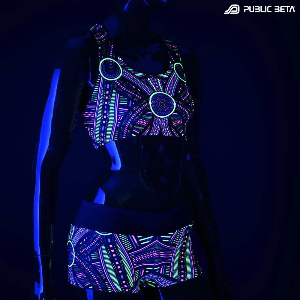 Active top with geometric UV-reactive graphics glowing under blacklight