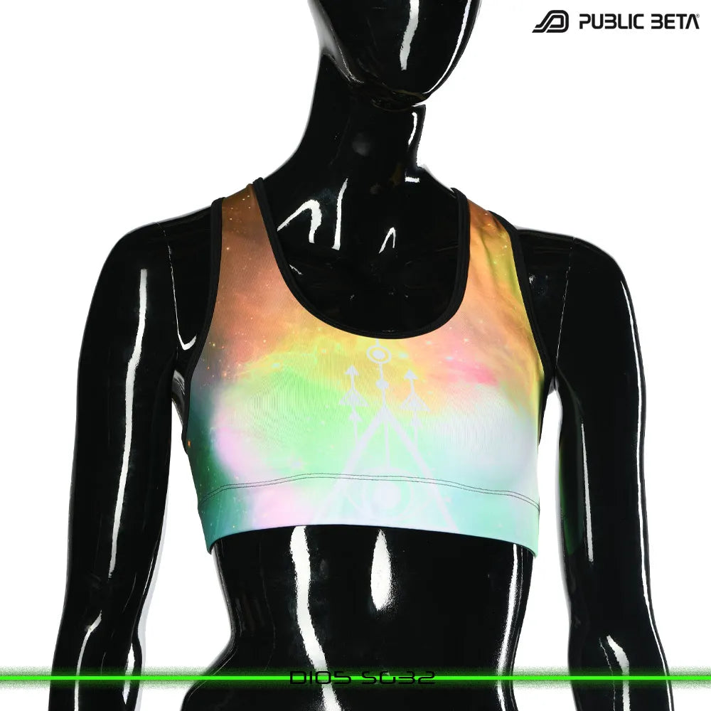 Active top with geometric UV-reactive graphics, photographed in natural light