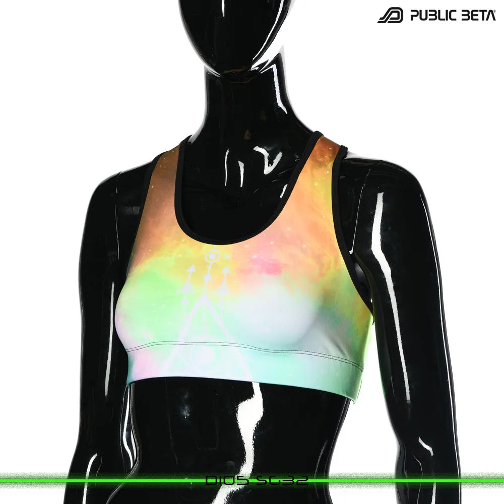 Active top with geometric UV-reactive graphics, photographed in natural light