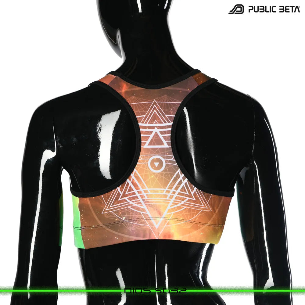 Active top with geometric UV-reactive graphics, photographed in natural light