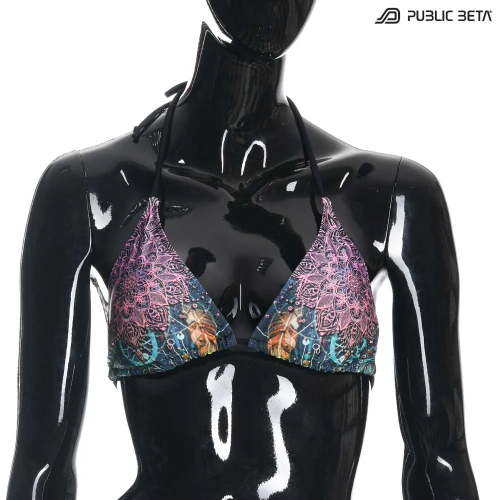 Bikini  set with UV-reactive printed graphics, photographed in natural light