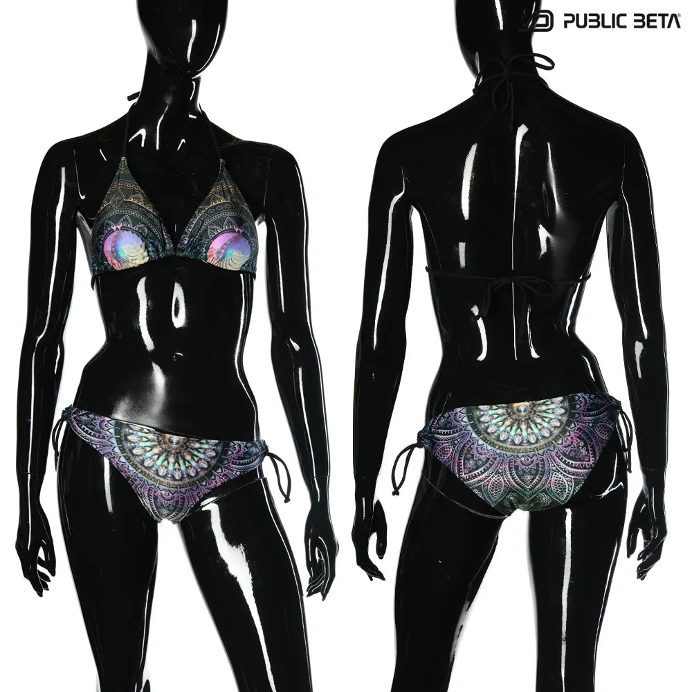 Bikini set with UV-reactive printed graphics, photographed in natural light