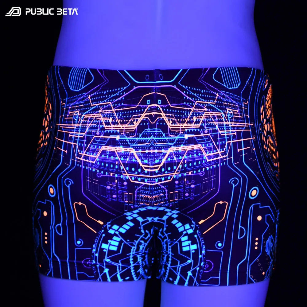 Swim shorts with UV-reactive psychedelic print glowing under blacklight