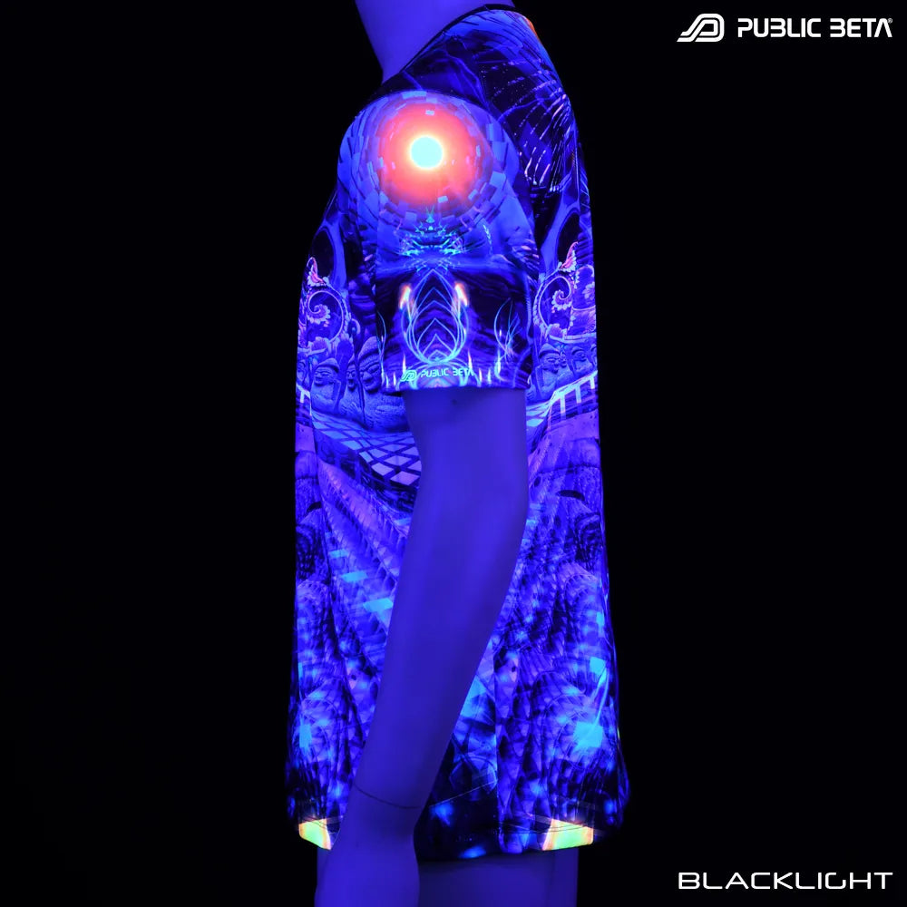 T-shirt with all-over UV-reactive print glowing under blacklight