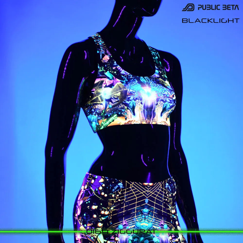 Active top with UV-reactive futuristic print glowing under blacklight