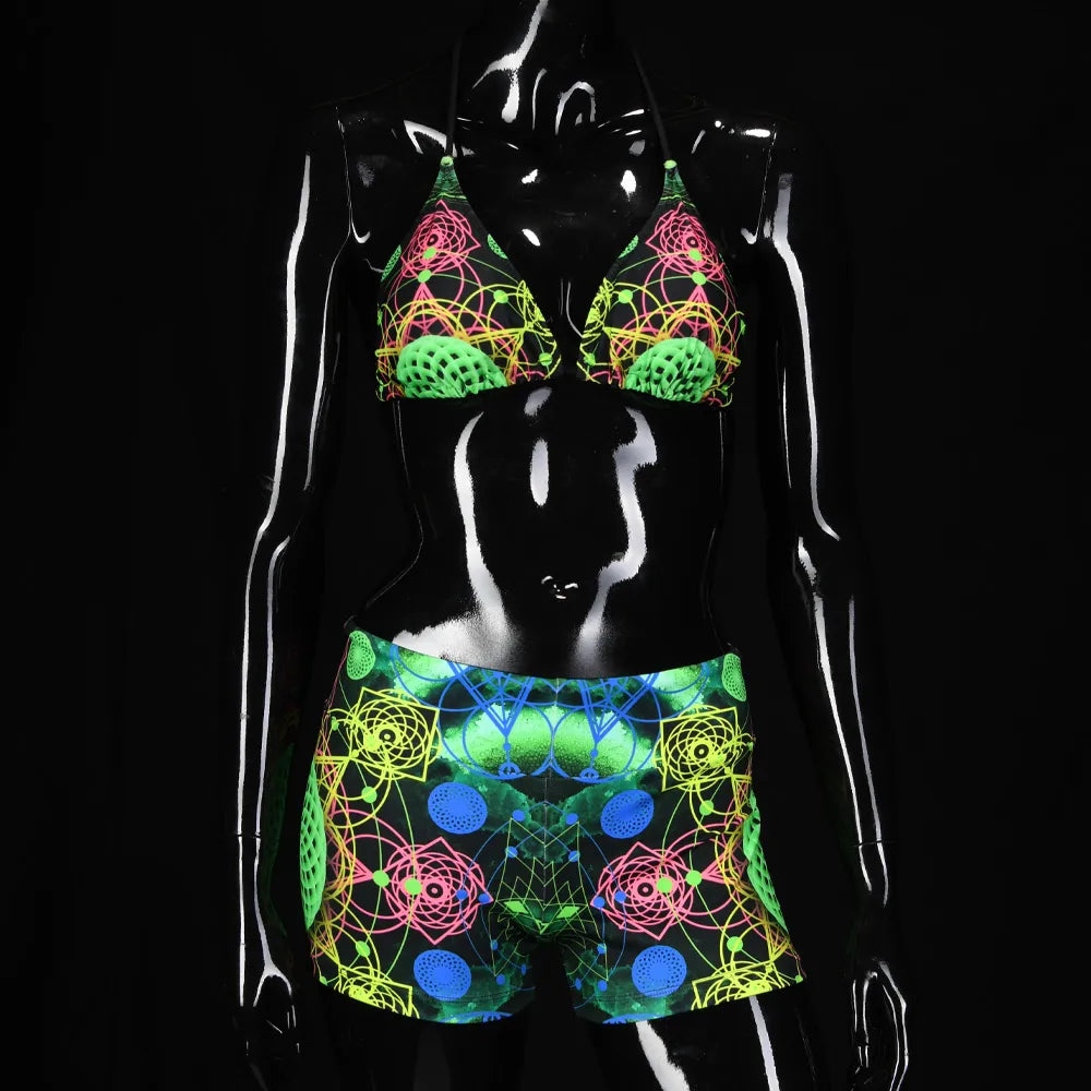 Shorts women with UV-reactive printed psychedelic graphics, photographed in natural light