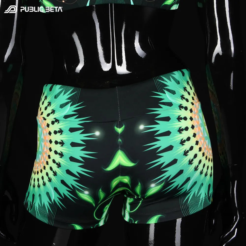 Shorts women with UV-reactive printed graphics, photographed in natural light back view