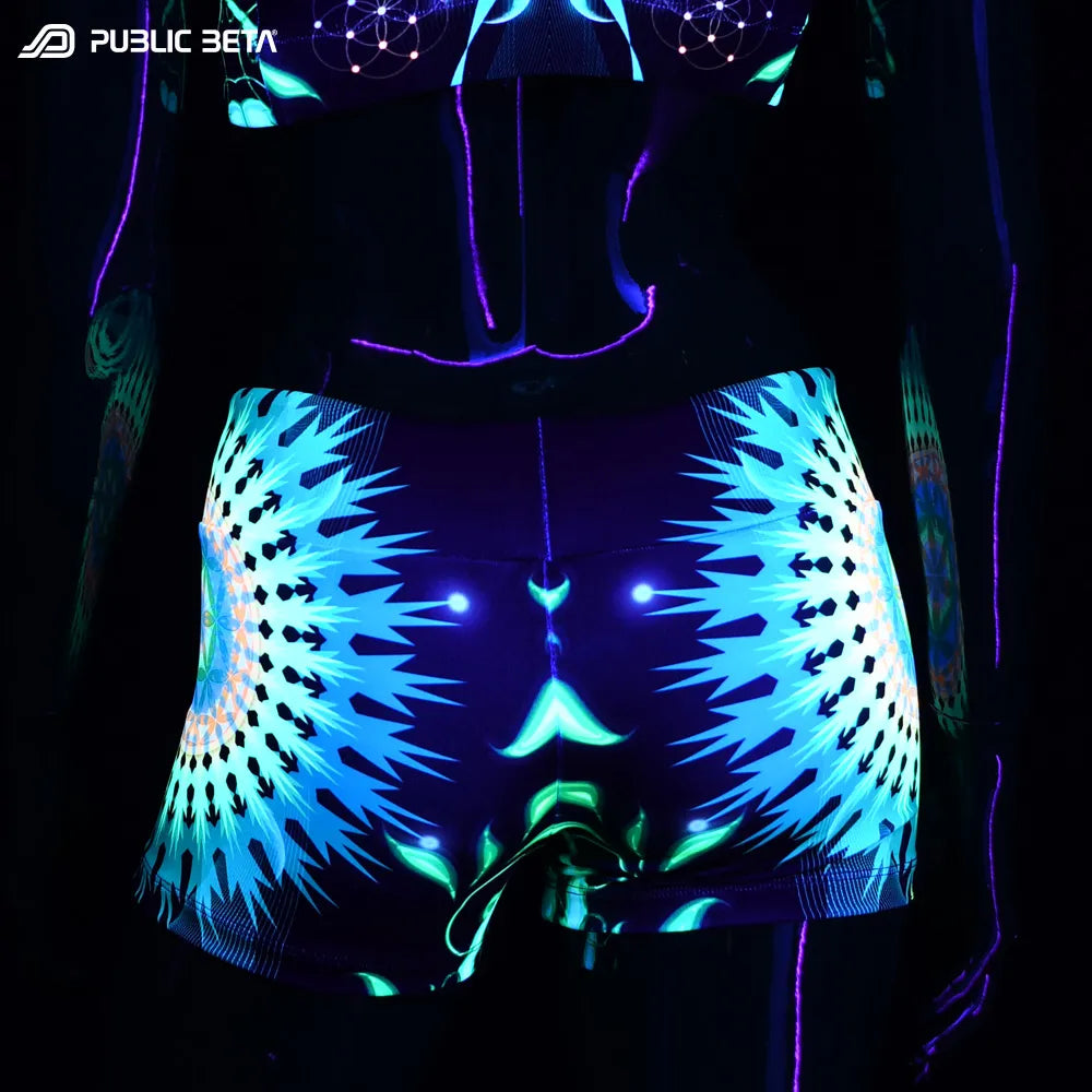 Shorts women with UV-reactive graphics glowing under blacklight