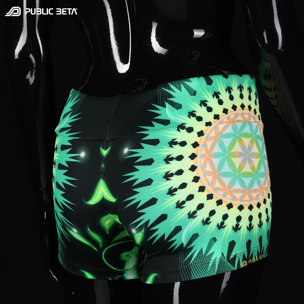 Shorts women with UV-reactive printed graphics, photographed in natural light side view