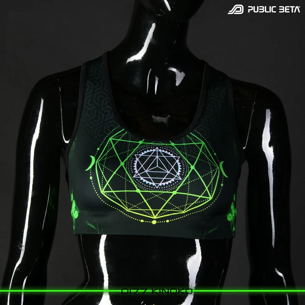 Active top with geometric UV-reactive graphics, photographed in natural light
