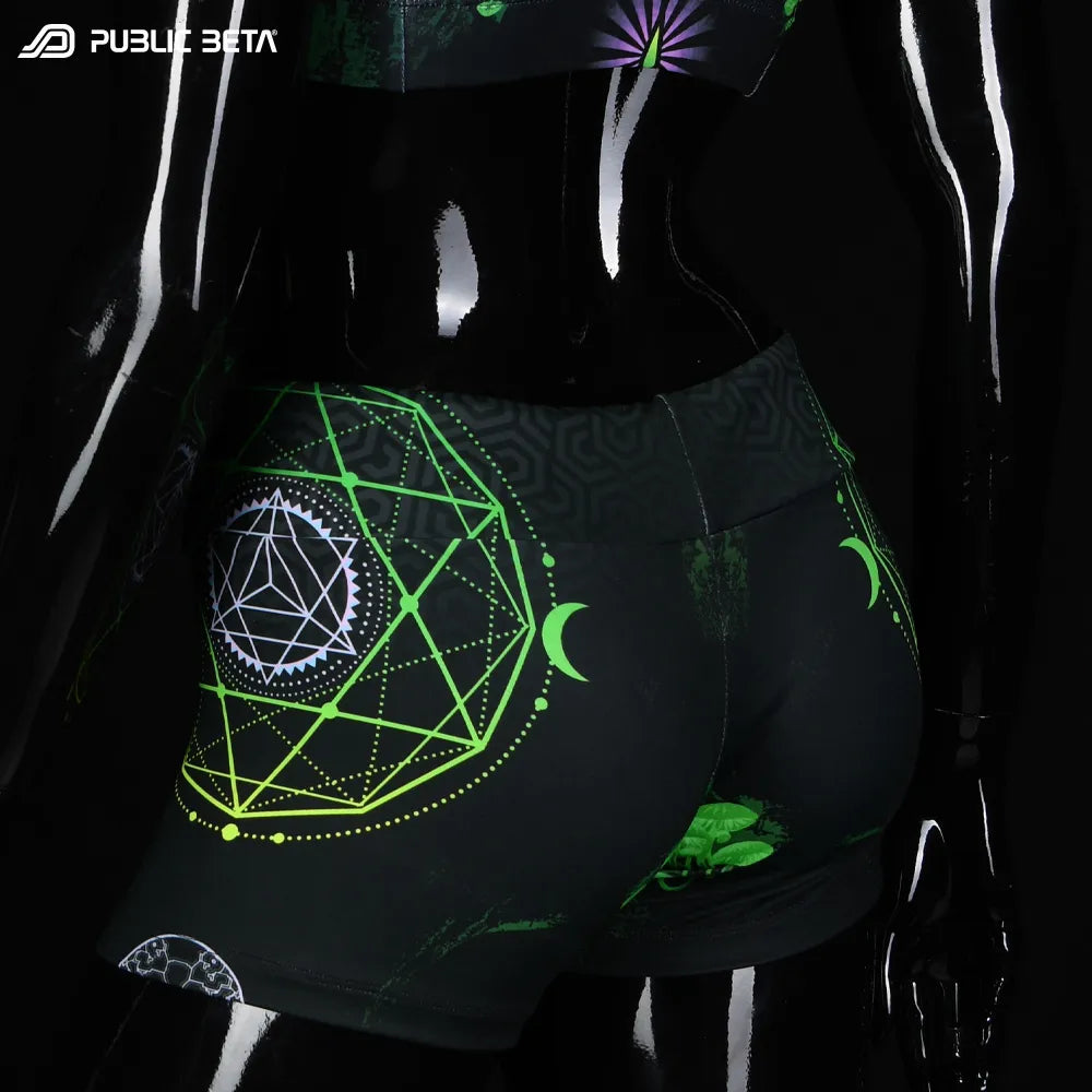 Shorts women with UV-reactive printed graphics, photographed in natural light side