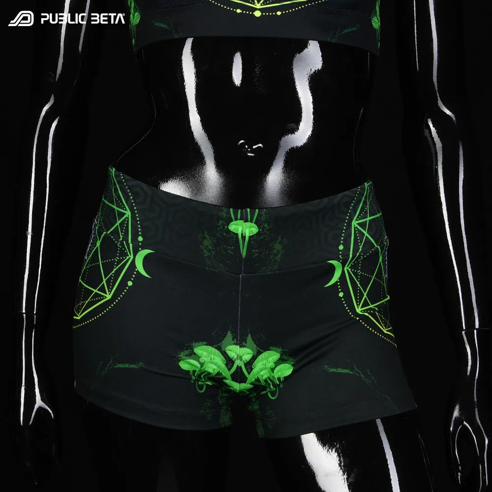 Shorts women with UV-reactive printed graphics, photographed in natural light 