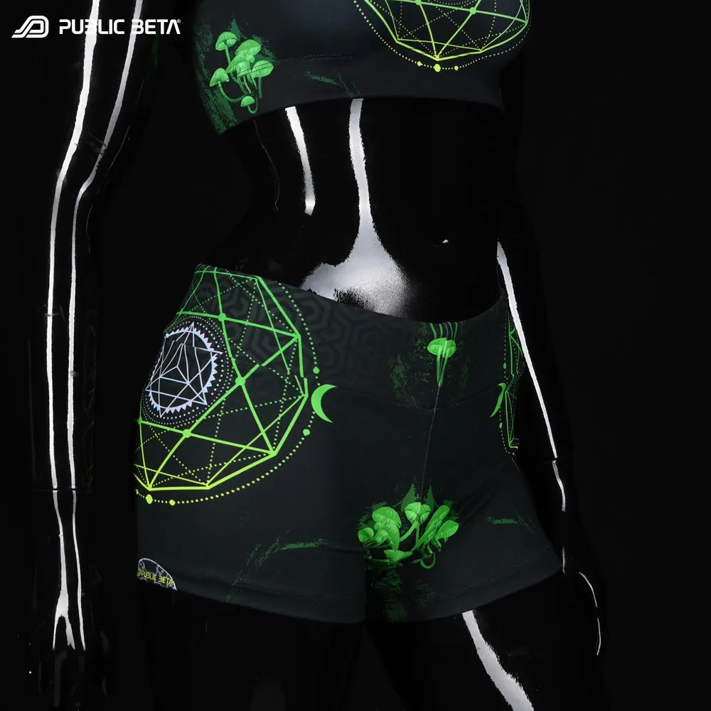 Shorts women with UV-reactive printed graphics, photographed in natural light front
