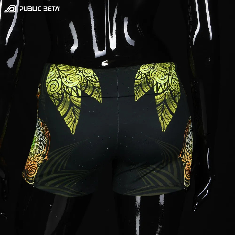 Shorts women with UV-reactive printed graphics, photographed in natural light back