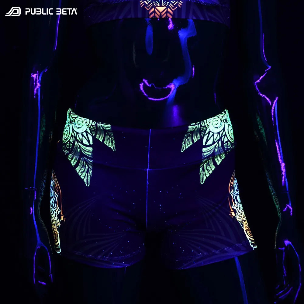 Shorts women with UV-reactive graphics glowing under blacklight