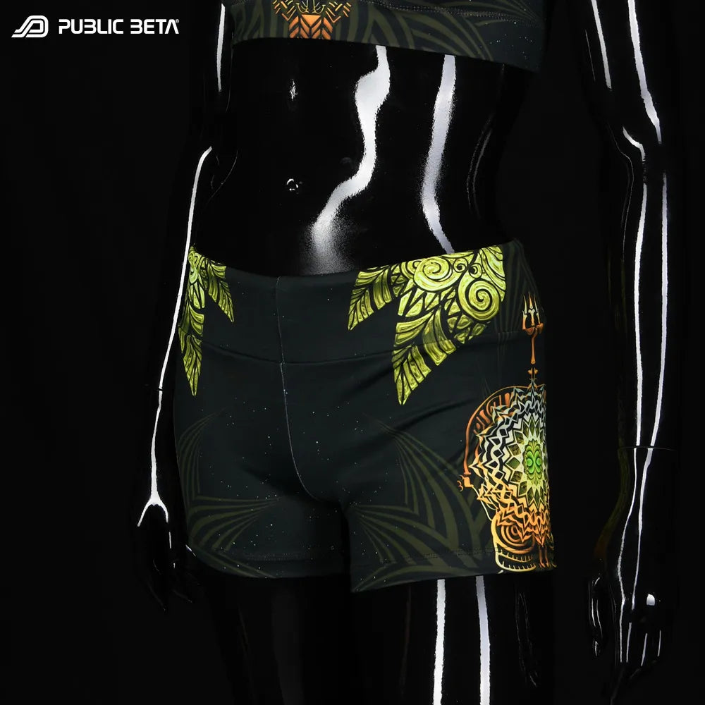 Shorts women with UV-reactive printed graphics, photographed in natural light front