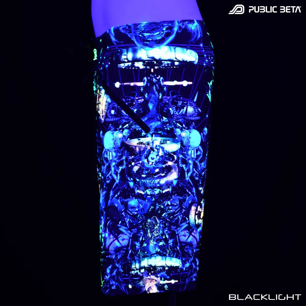 Boardshorts with UV-reactive graphics glowing under blacklight side view