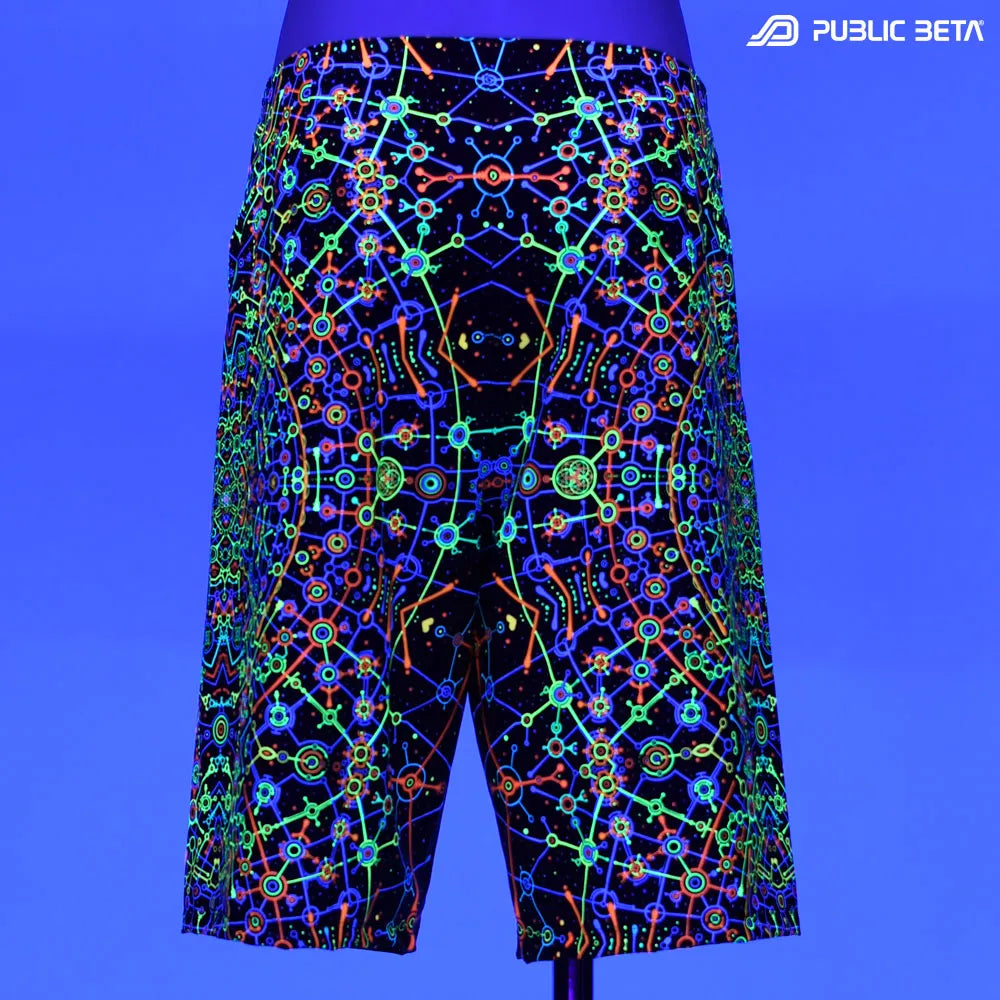 Boardshorts with UV-reactive psychedelic print glowing under blacklight