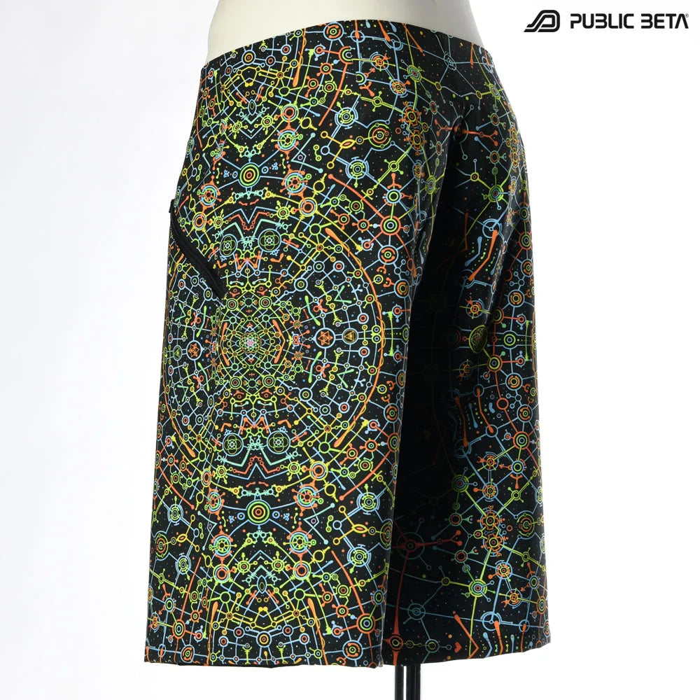 Boardshorts with UV-reactive psychedelic art print, photographed in natural light