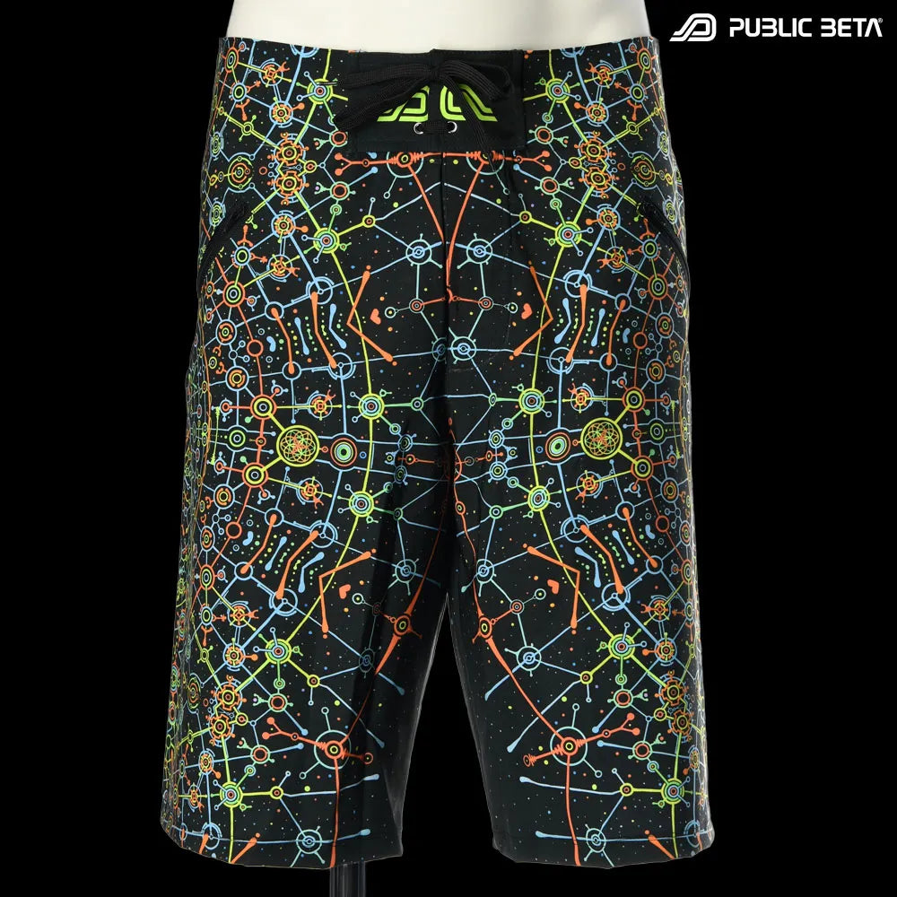 Boardshorts with UV-reactive psychedelic art print, photographed in natural light