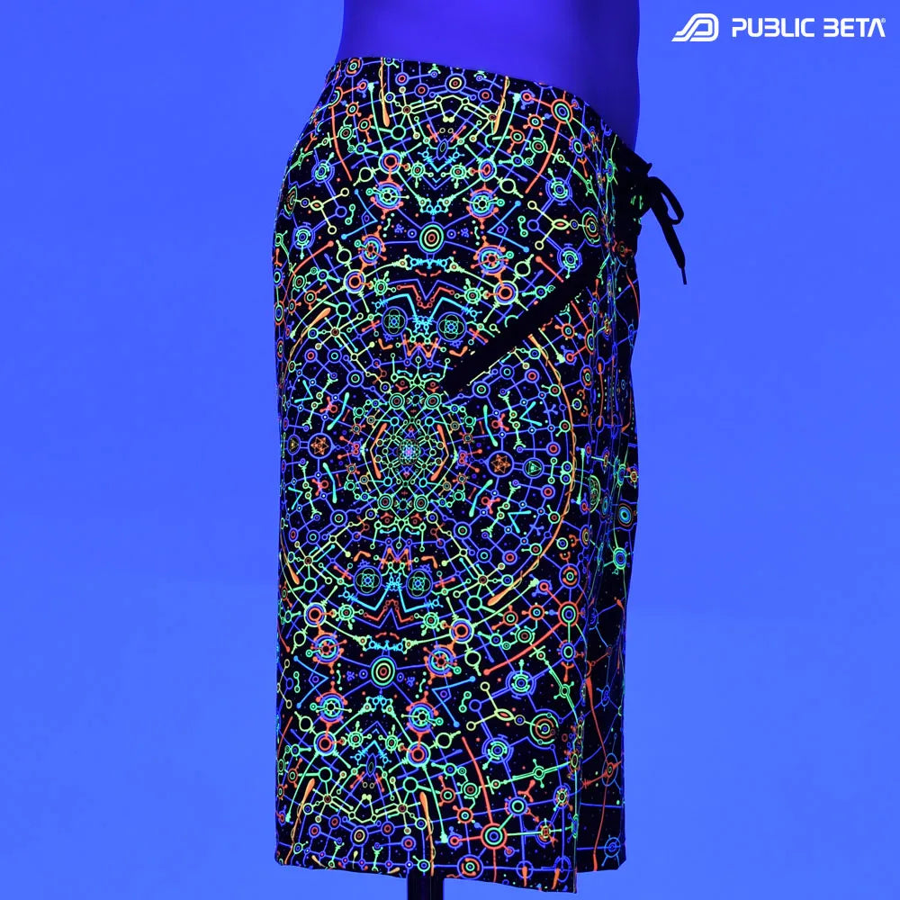 Boardshorts with UV-reactive psychedelic print glowing under blacklight
