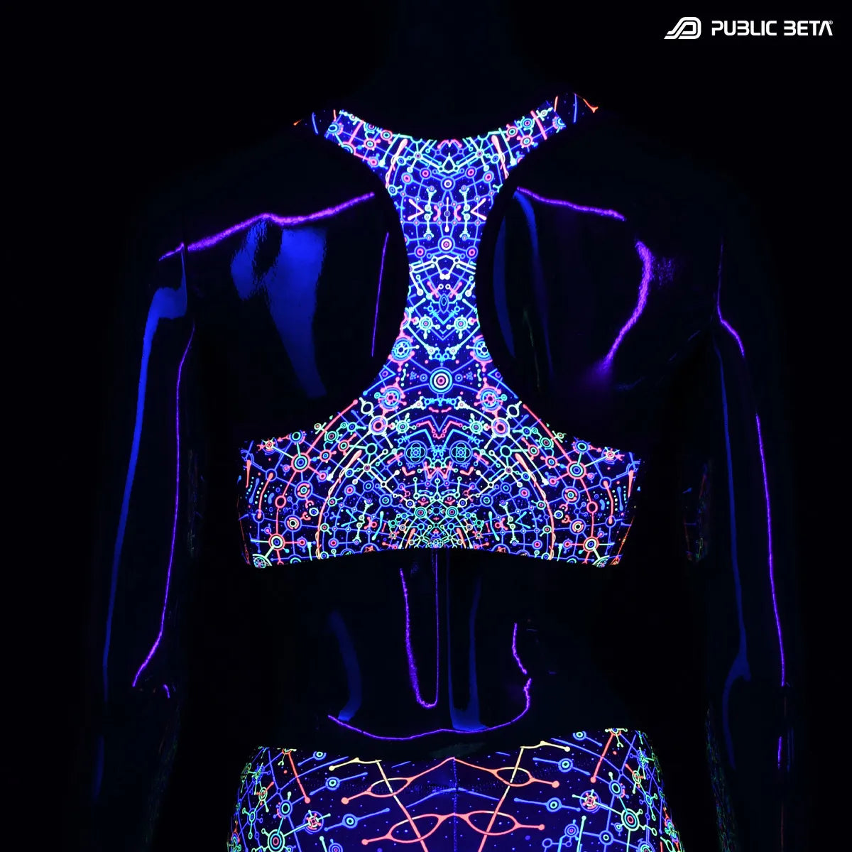 Active top with UV reactive art print glowing under blacklight