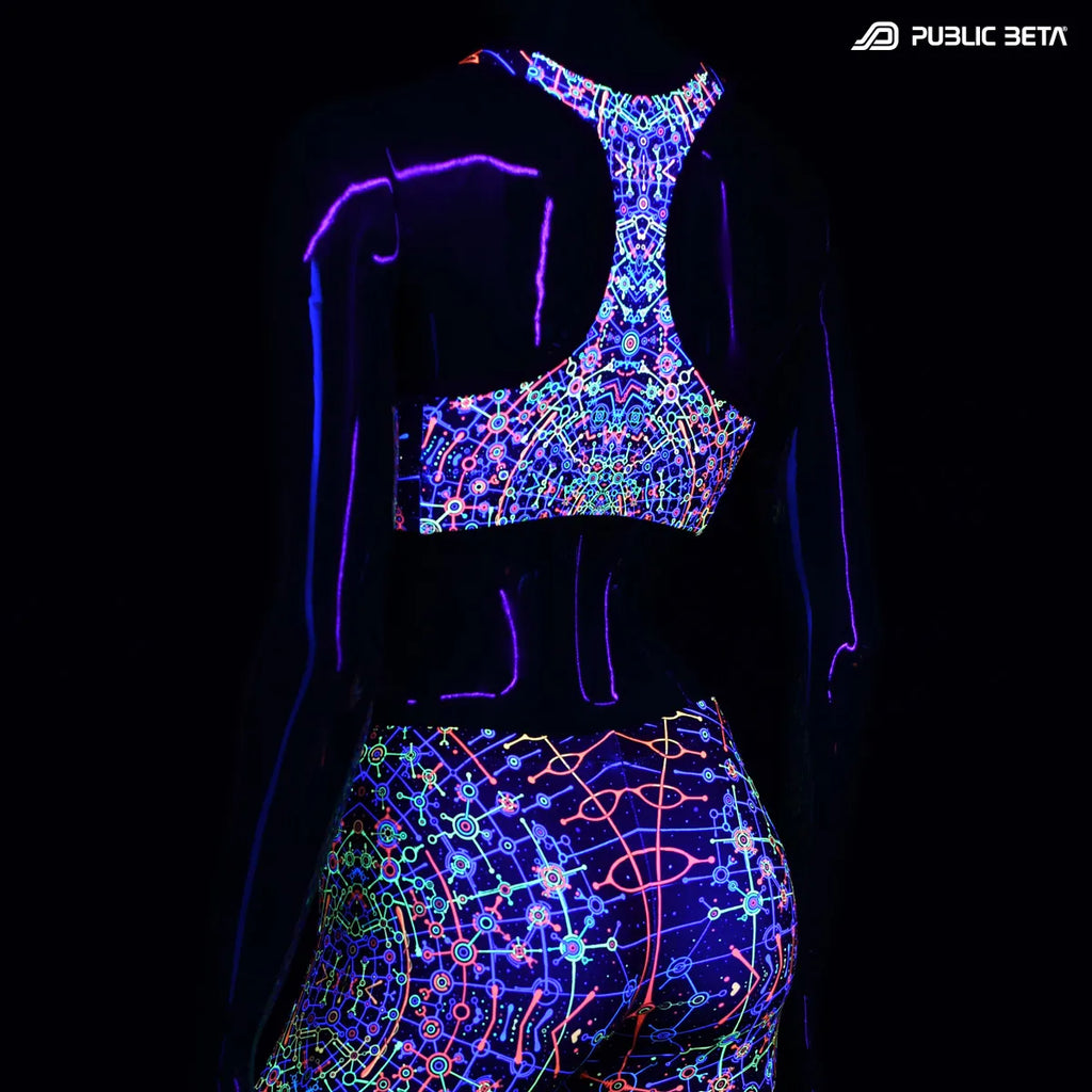 Active top with UV reactive art print glowing under blacklight