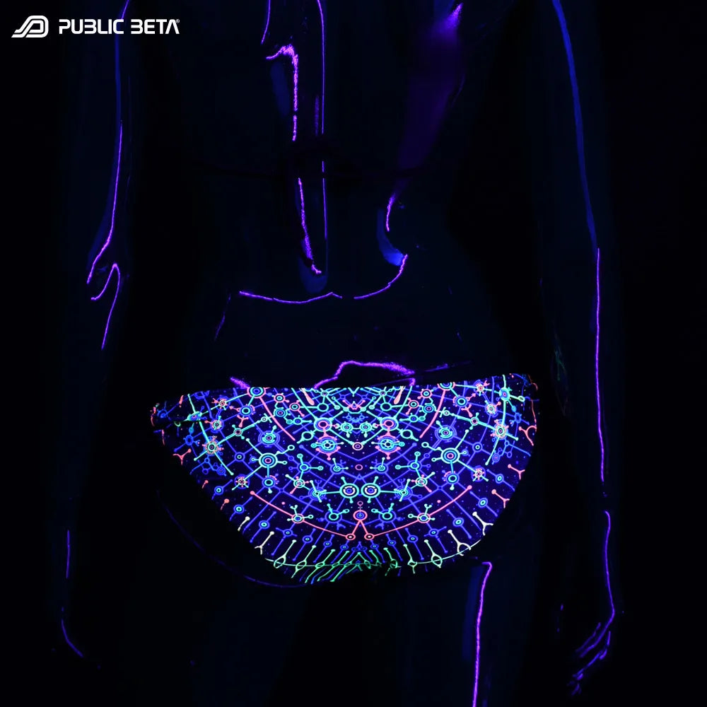 Bikini set with UV-reactive graphics glowing under blacklight