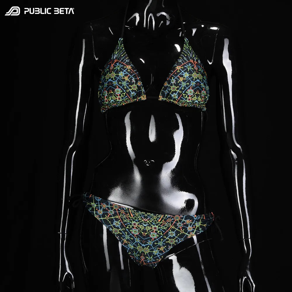 Bikini set with UV-reactive printed graphics, photographed in natural light