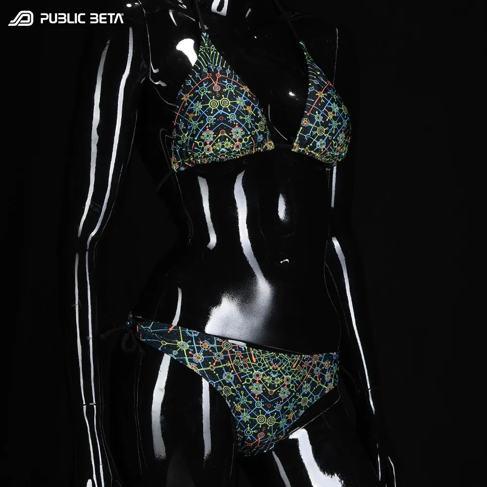 Bikini set with UV-reactive printed graphics, photographed in natural light