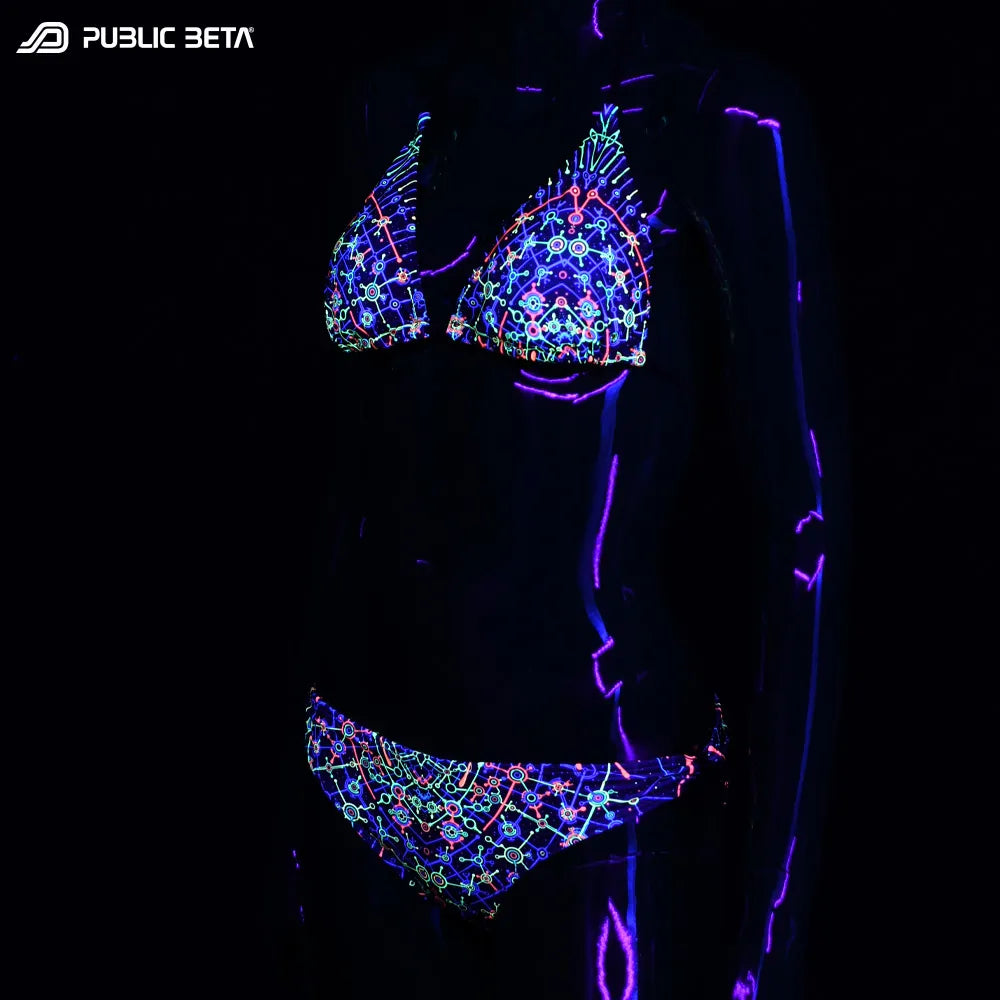 Bikini set with UV-reactive graphics glowing under blacklight