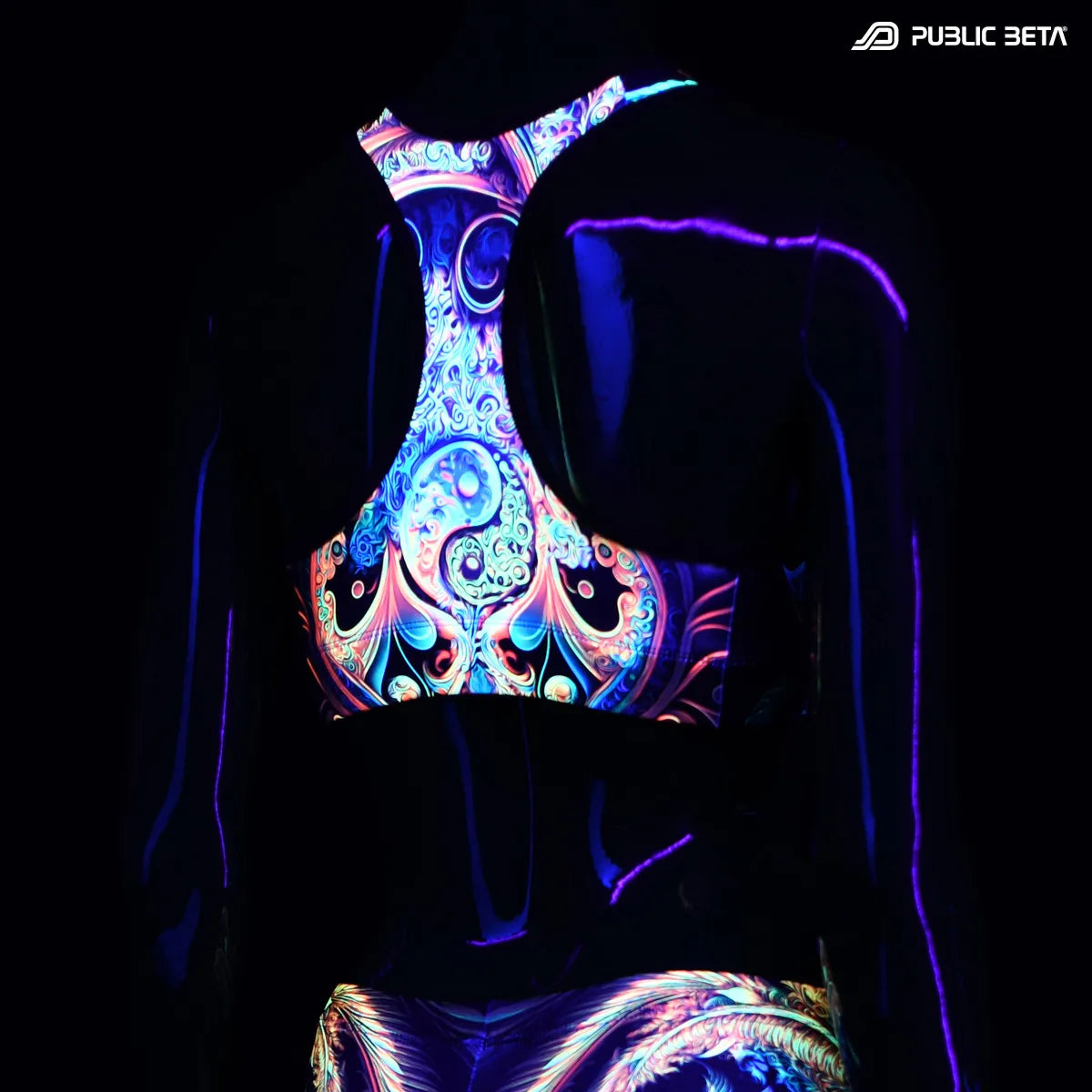 Active top with UV reactive art print glowing under blacklight