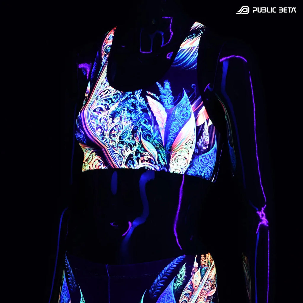 Active top with UV reactive art print glowing under blacklight