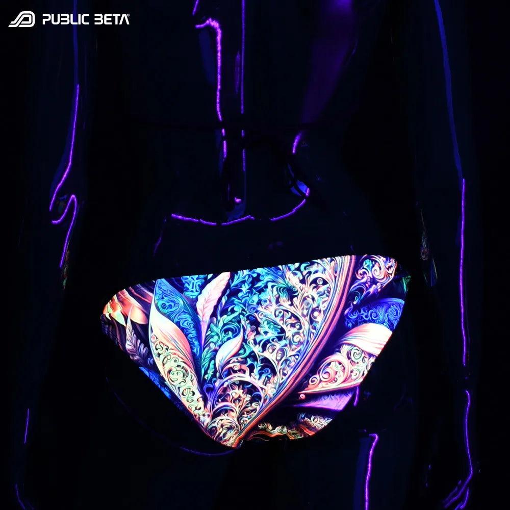 Bikini set with UV-reactive graphics glowing under blacklight