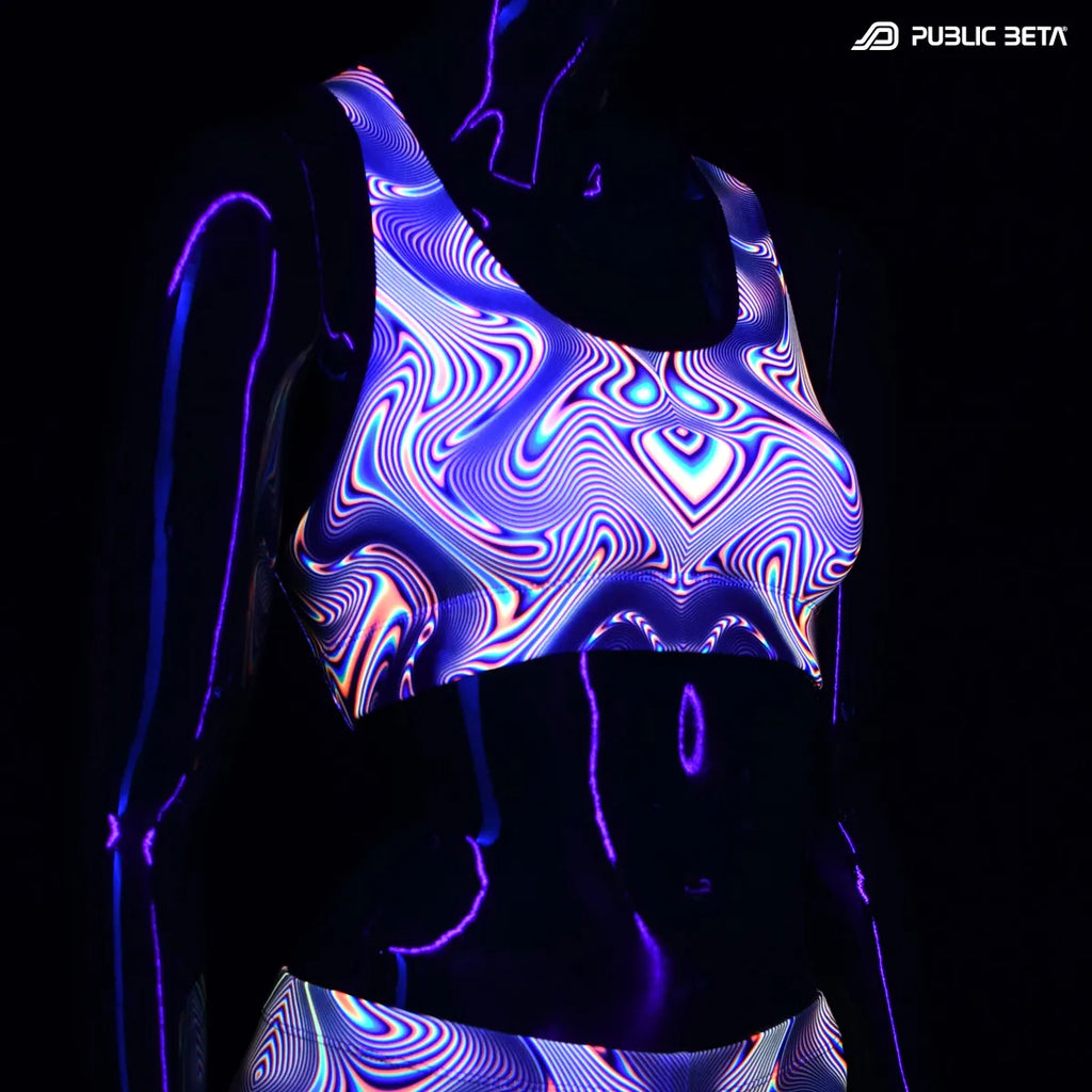 Active top with UV reactive art print glowing under blacklight