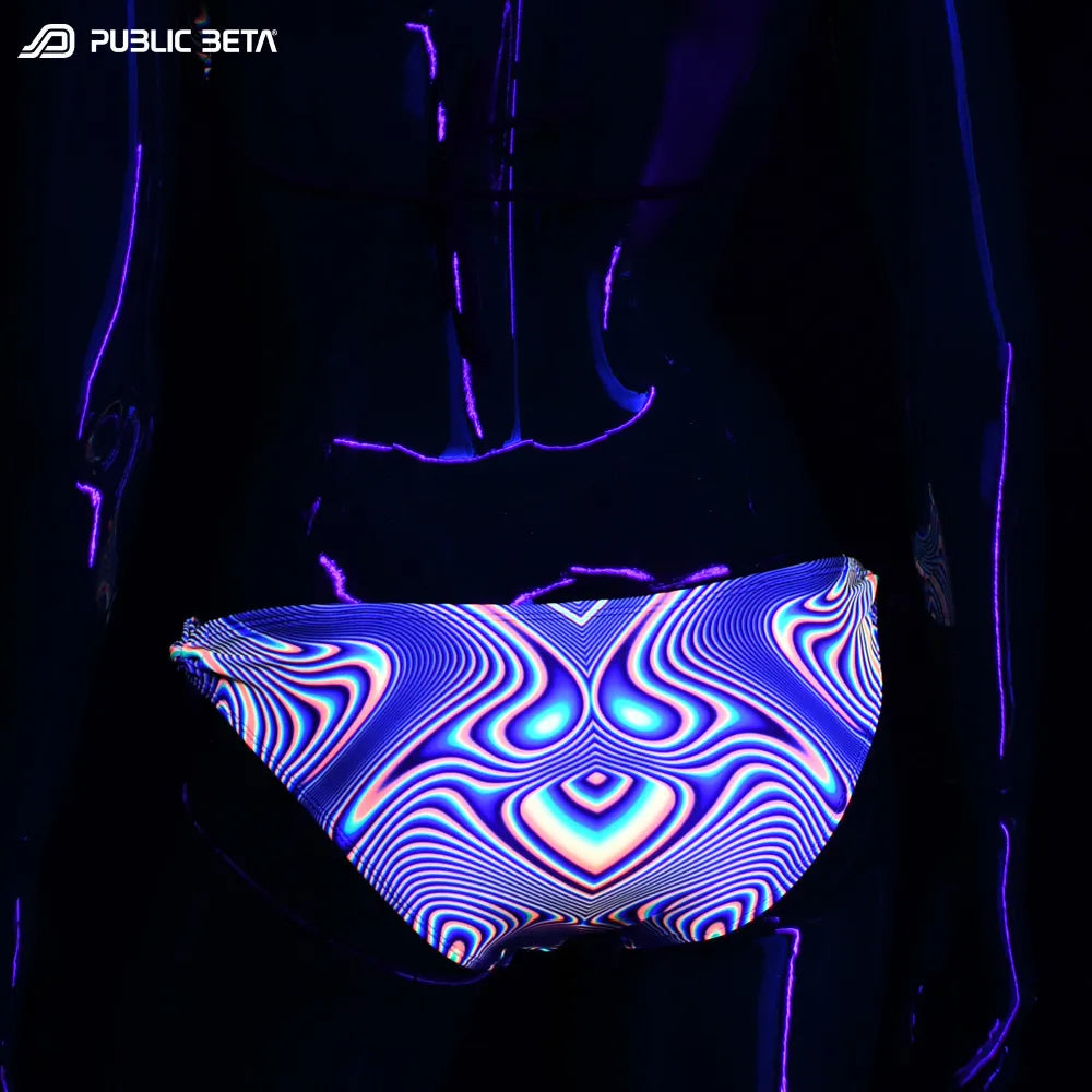 Bikini set with UV-reactive graphics glowing under blacklight bottom