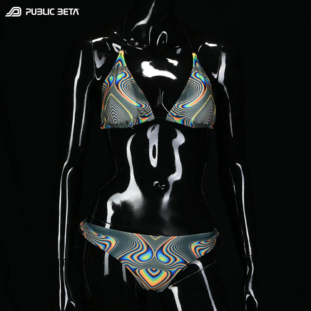 Bikini set with UV-reactive printed graphics, photographed in natural light