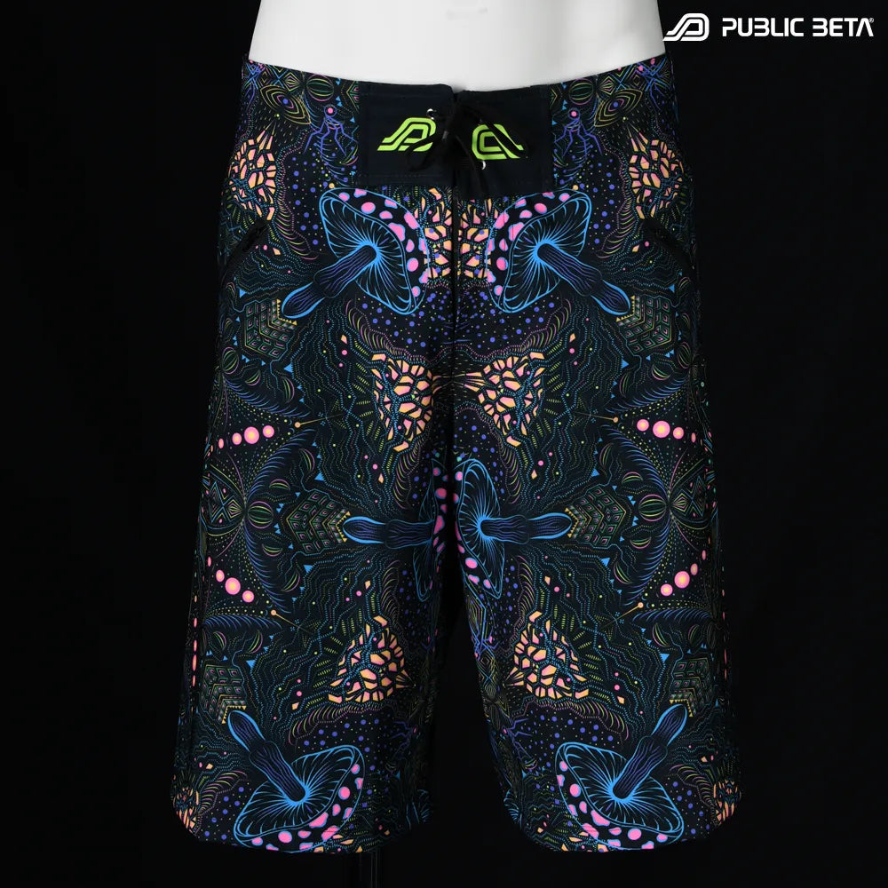 Boardshorts with organic mushroom patter UV-reactive print, photographed in natural light