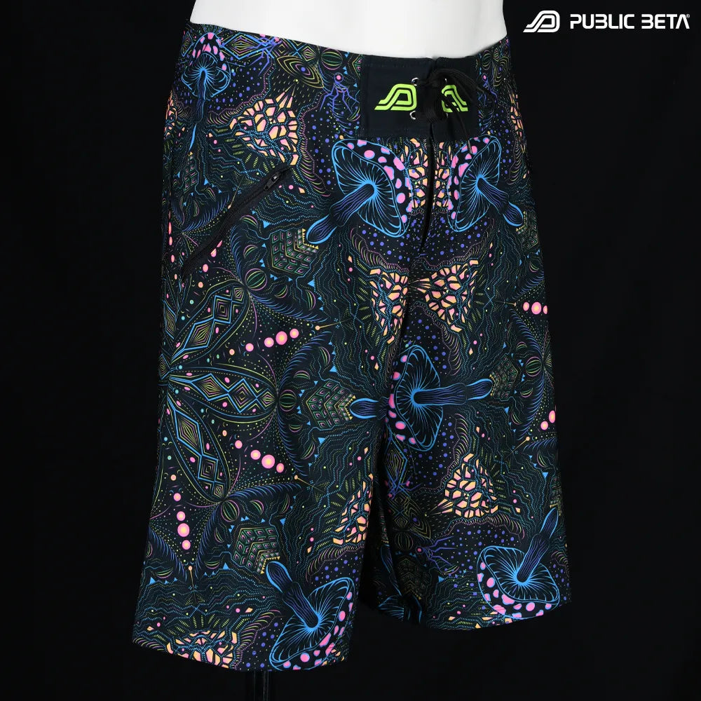 Boardshorts with organic mushroom patter UV-reactive print, photographed in natural light