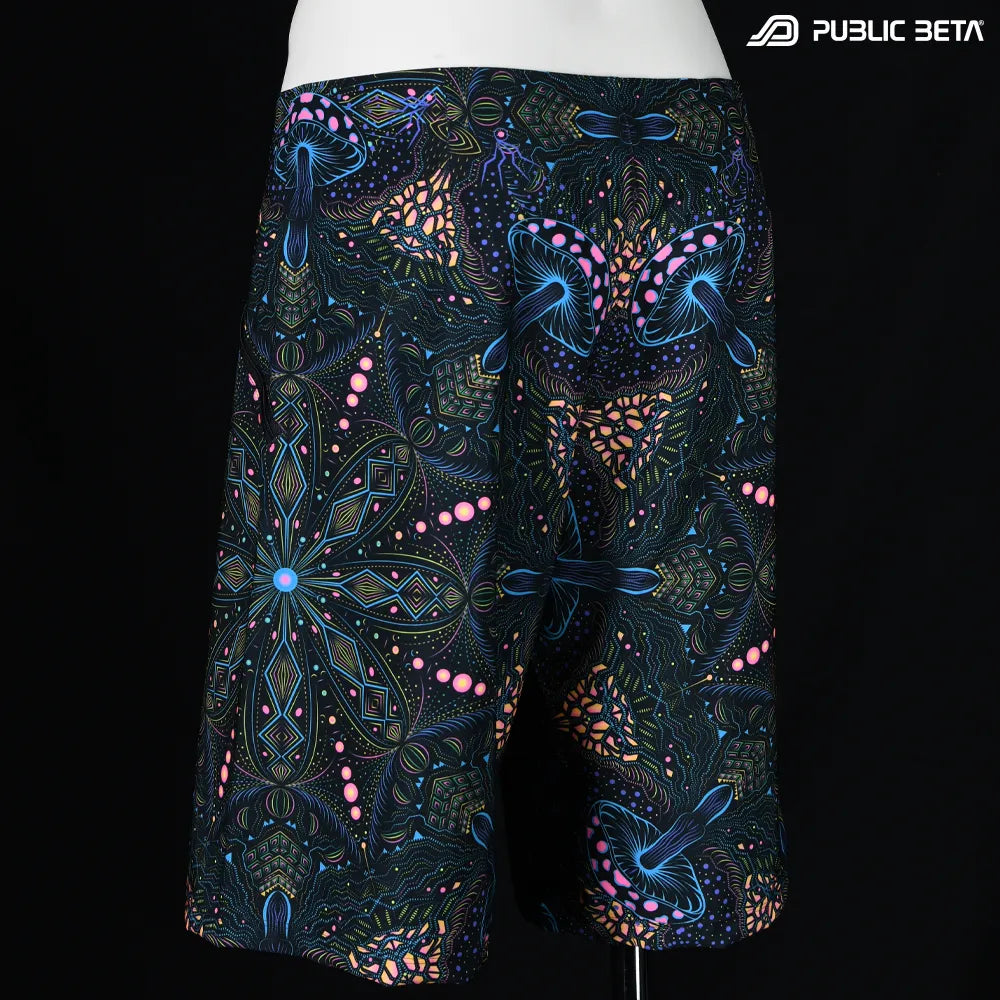 Boardshorts with organic mushroom patter UV-reactive print, photographed in natural light