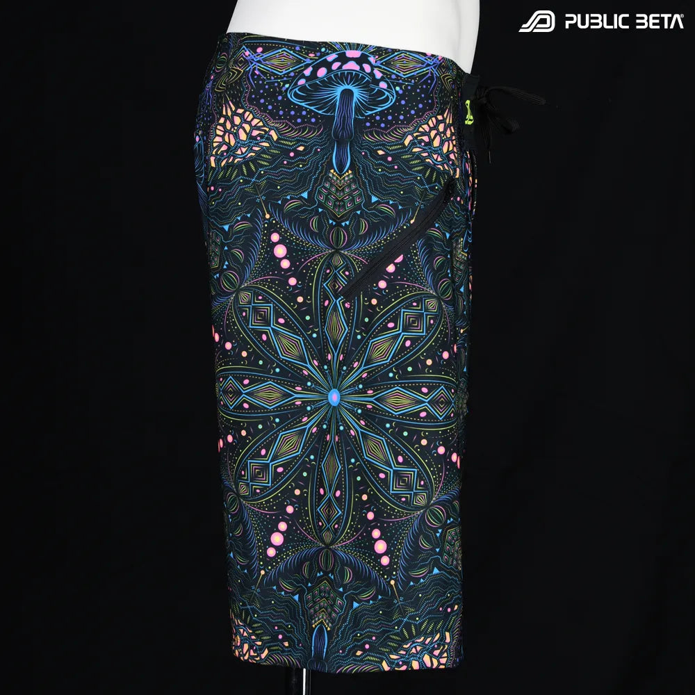 Boardshorts with organic mushroom patter UV-reactive print, photographed in natural light