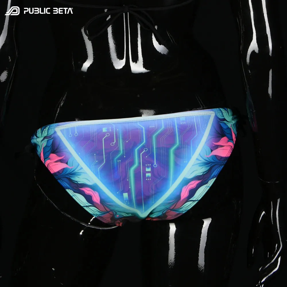 Bikini set with UV-reactive printed graphics, photographed in natural light buttom