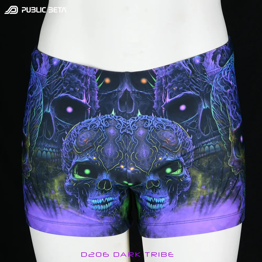Swim shorts with UV-reactive futuristic graphics, photographed in natural light