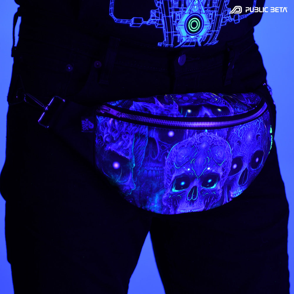 Bum bag with blue tribal skulls print glowing under blacklight