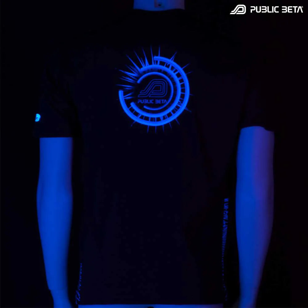 T-shirt with geometric UV-reactive graphics glowing under blacklight