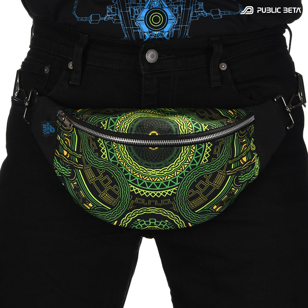 Bum bag with green and yellow geometric tribal mandala print, photographed in natural light