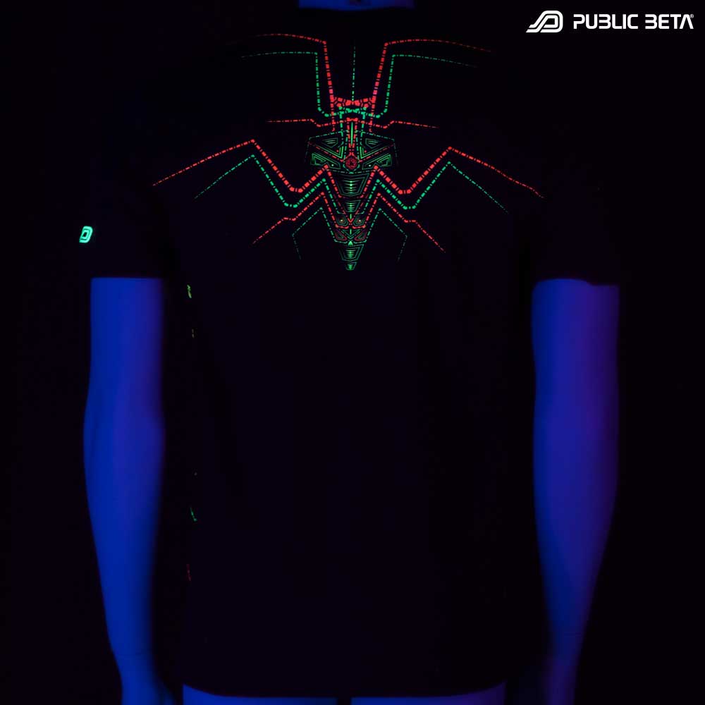 T-shirt with Lotus UV-reactive graphics glowing under blacklight