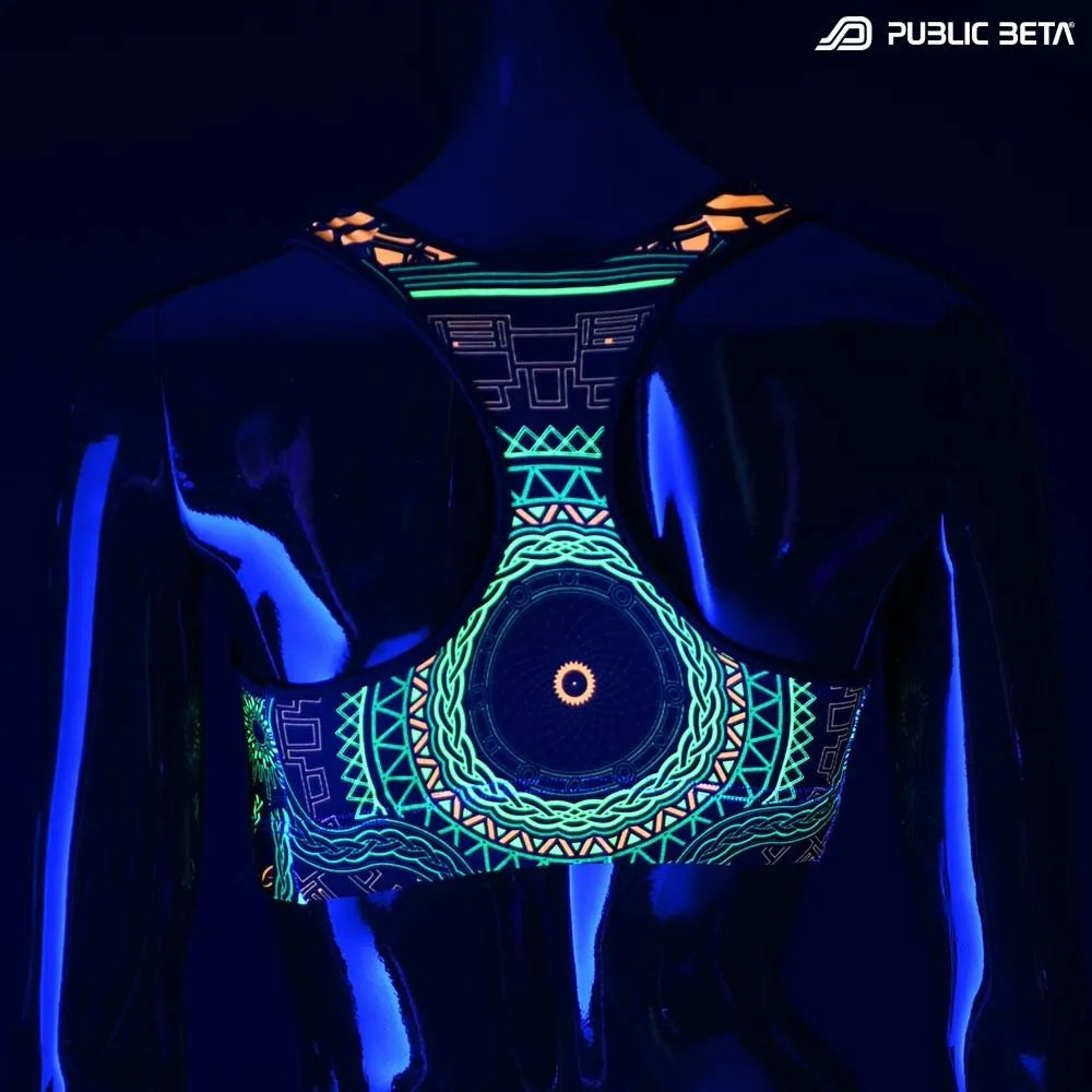 Active top with geometric UV-reactive graphics glowing under blacklight